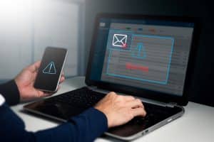 A man’s computer is overrun with warnings and phishing pop-ups.